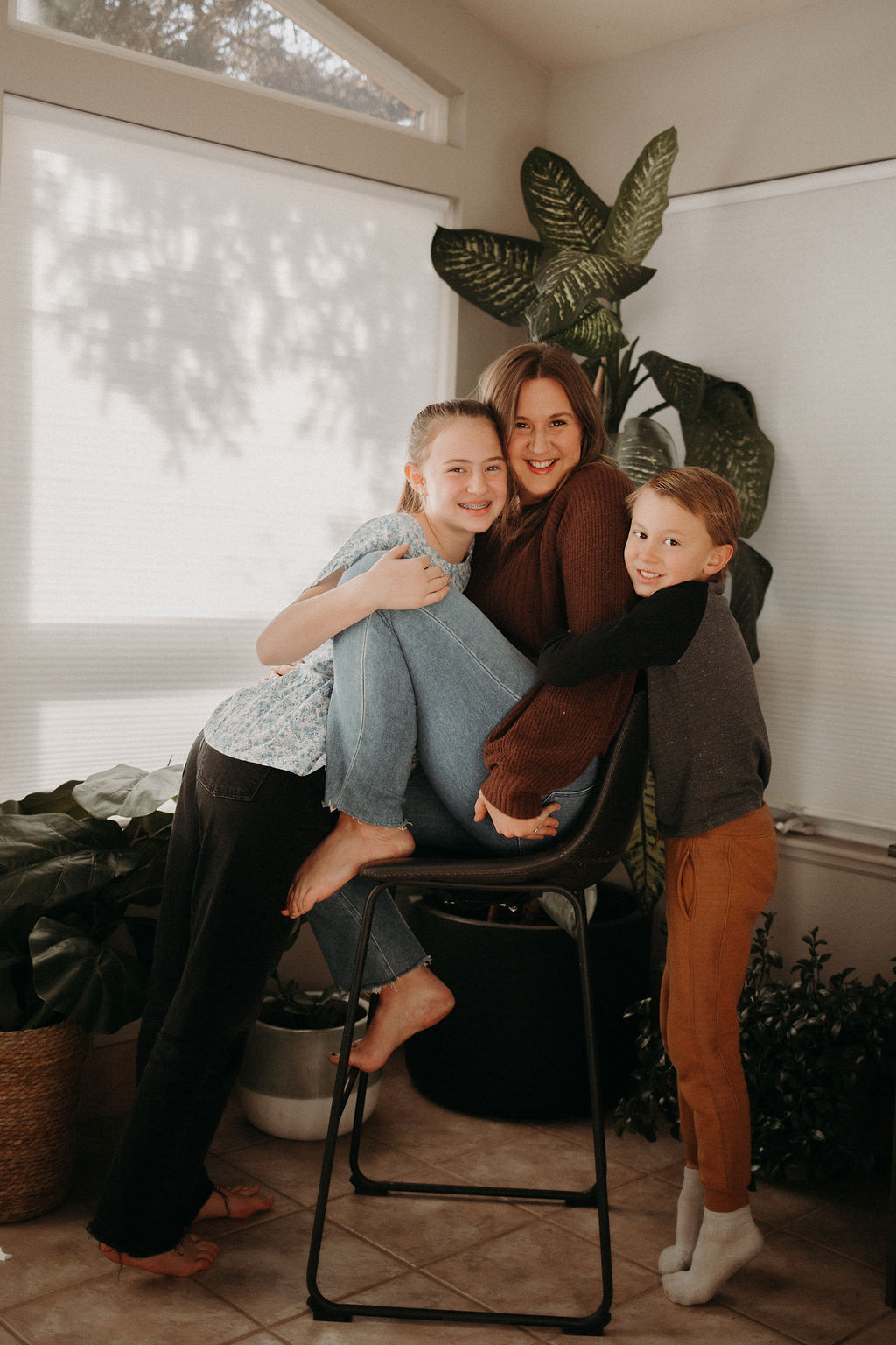 Mom and her two kids mental load of motherhood