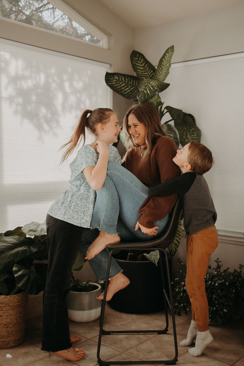 Mom and her kids discussing the mental load of motherhood